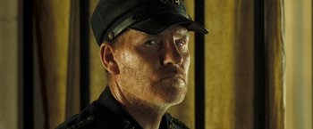 Movie still from “The Proposition” (2005), directed by John Hillcoat – A person wearing a hat; Close Up shot, Low angle