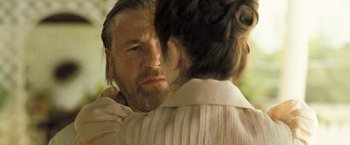 Movie still from “The Proposition” (2005), directed by John Hillcoat – A man and a woman face to face; Close Up shot, Over the shoulder angle