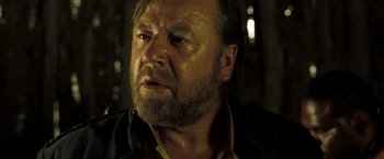 Movie still from “The Proposition” (2005), directed by John Hillcoat – A person with a beard; Close Up shot, Low angle