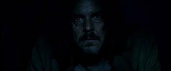 Movie still from “The Proposition” (2005), directed by John Hillcoat – A person with long hair; Close Up shot, Low angle