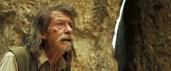 Movie still from “The Proposition” (2005), directed by John Hillcoat – An old man with long hair and a mustache; Close Up shot, Low angle