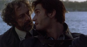 Movie still from “The Punisher” (1989), directed by Mark Goldblatt – A man and a woman are looking at one another; Close Up shot, Over the shoulder angle