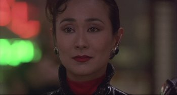 Movie still from “The Punisher” (1989), directed by Mark Goldblatt – A person wearing a leather jacket; Close Up shot, Over the shoulder angle