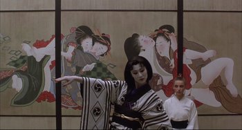 Movie still from “The Punisher” (1989), directed by Mark Goldblatt – A woman dressed in traditional japanese garb; Medium shot, Low angle