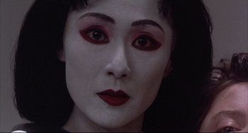 Movie still from “The Punisher” (1989), directed by Mark Goldblatt – A person with makeup on face; Close Up shot, Low angle