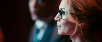 Movie still from “The Purge: Election Year” (2016), directed by James DeMonaco – A person wearing glasses; Close Up shot, Over the shoulder angle
