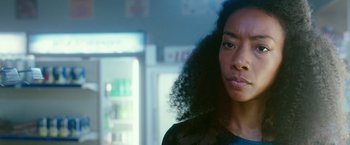 Movie still from “The Purge: Election Year” (2016), directed by James DeMonaco – A person wearing a black shirt; Close Up shot, Over the shoulder angle