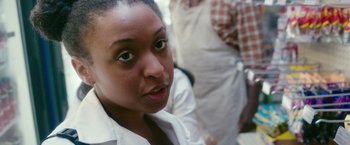 Movie still from “The Purge: Election Year” (2016), directed by James DeMonaco – A person wearing a white shirt; Close Up shot, Over the shoulder angle