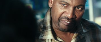 Movie still from “The Purge: Election Year” (2016), directed by James DeMonaco – A man's face in a plaid shirt; Close Up shot, Over the shoulder angle