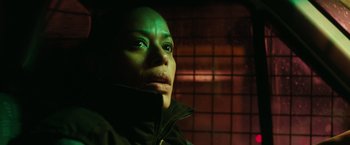 Movie still from “The Purge: Election Year” (2016), directed by James DeMonaco – A person wearing a black jacket; Close Up shot, Low angle