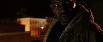 Movie still from “The Purge: Election Year” (2016), directed by James DeMonaco – A man's face at night; Close Up shot, Low angle