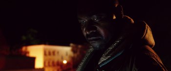 Movie still from “The Purge: Election Year” (2016), directed by James DeMonaco – A person wearing a jacket; Close Up shot, Low angle