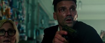 Movie still from “The Purge: Election Year” (2016), directed by James DeMonaco – A person holding a knife; Close Up shot, Low angle