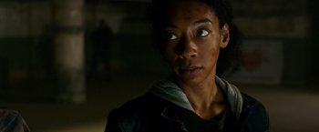 Movie still from “The Purge: Election Year” (2016), directed by James DeMonaco – A person with a hooded jacket looking at the camera; Close Up shot, Low angle