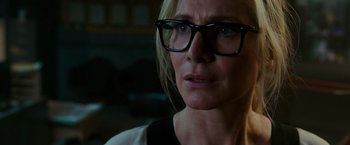Movie still from “The Purge: Election Year” (2016), directed by James DeMonaco – A person wearing glasses; Close Up shot, Over the shoulder angle