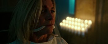 Movie still from “The Purge: Election Year” (2016), directed by James DeMonaco – A woman with a toothbrush in her mouth; Close Up shot, High angle