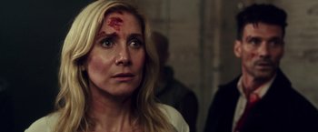 Movie still from “The Purge: Election Year” (2016), directed by James DeMonaco – A person with blood on her face; Close Up shot, Over the shoulder angle