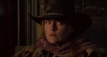 Movie still from “The Quick and the Dead” (1995), directed by Sam Raimi – A person wearing a cowboy hat; Close Up shot, Low angle