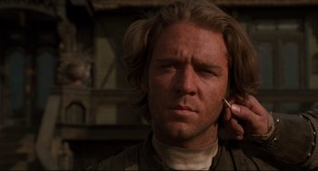 Movie still from “The Quick and the Dead” (1995), directed by Sam Raimi – A person with long blonde hair; Close Up shot, Low angle