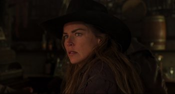 Movie still from “The Quick and the Dead” (1995), directed by Sam Raimi – A person wearing a hat; Close Up shot, Over the shoulder angle
