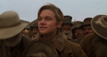 Movie still from “The Quick and the Dead” (1995), directed by Sam Raimi – A group of men in cowboy hats standing next to each other; Close Up shot, Low angle