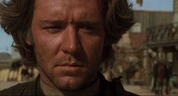 Movie still from “The Quick and the Dead” (1995), directed by Sam Raimi – A man with long hair; Close Up shot, Low angle