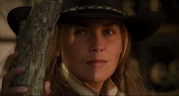 Movie still from “The Quick and the Dead” (1995), directed by Sam Raimi – A person wearing a cowboy hat; Close Up shot, Low angle