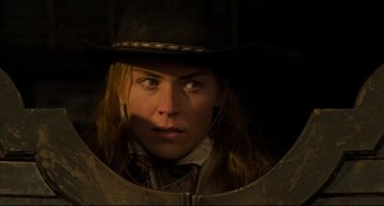 Movie still from “The Quick and the Dead” (1995), directed by Sam Raimi – A person wearing a cowboy hat; Close Up shot, Low angle