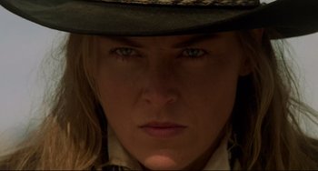 Movie still from “The Quick and the Dead” (1995), directed by Sam Raimi – A person wearing a cowboy hat; Close Up shot, Low angle