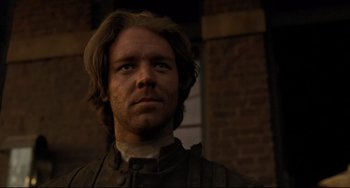 Movie still from “The Quick and the Dead” (1995), directed by Sam Raimi – A person with long brown hair; Close Up shot, Low angle