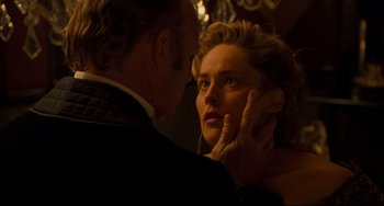 Movie still from “The Quick and the Dead” (1995), directed by Sam Raimi – A man and a woman looking into each others eyes; Close Up shot, Over the shoulder angle