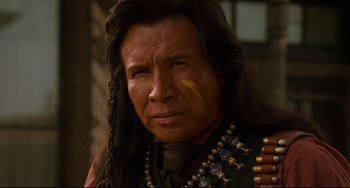 Movie still from “The Quick and the Dead” (1995), directed by Sam Raimi – A person wearing a costume; Close Up shot, Over the shoulder angle