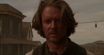 Movie still from “The Quick and the Dead” (1995), directed by Sam Raimi – A person with long brown hair; Close Up shot, Low angle