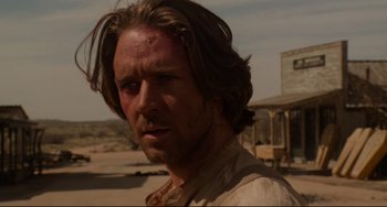 Movie still from “The Quick and the Dead” (1995), directed by Sam Raimi – A person wearing a shirt; Close Up shot, Over the shoulder angle