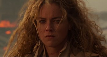 Movie still from “The Quick and the Dead” (1995), directed by Sam Raimi – A person with long blonde hair; Close Up shot, Low angle