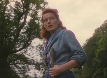 Movie still from “The Quiet Man” (1952), directed by John Ford – A woman in a denim shirt and a scarf; Medium shot, Low angle