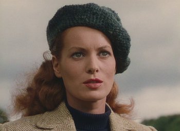 Movie still from “The Quiet Man” (1952), directed by John Ford – A person wearing a jacket and a hat; Close Up shot, Low angle