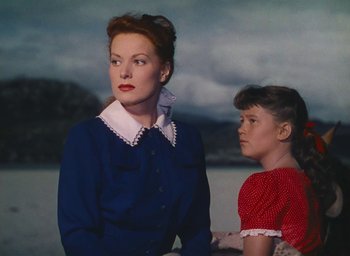 Movie still from “The Quiet Man” (1952), directed by John Ford – A woman and a girl standing next to each other; Medium shot, Low angle