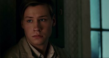 Movie still from “The Reader” (2008), directed by Stephen Daldry – A young man is looking into the camera; Close Up shot, Over the shoulder angle