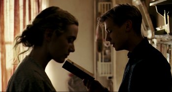 Movie still from “The Reader” (2008), directed by Stephen Daldry – A man and a woman looking at each other; Close Up shot, Over the shoulder angle