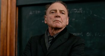 Movie still from “The Reader” (2008), directed by Stephen Daldry – An older man wearing a suit and tie; Close Up shot, Low angle