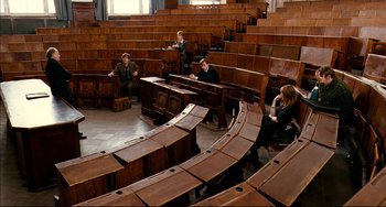 Movie still from “The Reader” (2008), directed by Stephen Daldry – A group of people sitting in rows of wooden seats; Wide shot, High angle