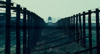 Movie still from “The Reader” (2008), directed by Stephen Daldry – A train track leading to a train station; Extreme Wide shot, Low angle