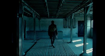 Movie still from “The Reader” (2008), directed by Stephen Daldry – A person walking on a wooden floor in a building; Wide shot, Low angle