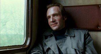 Movie still from “The Reader” (2008), directed by Stephen Daldry – A man sitting on a train looking out the window; Close Up shot, Low angle