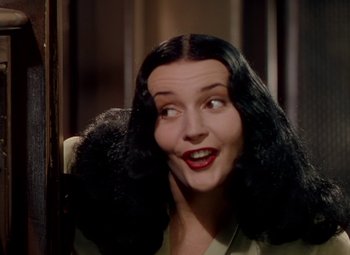 Movie still from “The Red Shoes” (1948), directed by Michael Powell – A person with long black hair; Close Up shot, Low angle