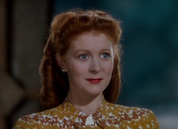 Movie still from “The Red Shoes” (1948), directed by Michael Powell – A person wearing a yellow and white shirt; Close Up shot, High angle