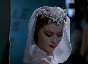 Movie still from “The Red Shoes” (1948), directed by Michael Powell – A woman wearing a white veil and a tiara; Close Up shot, High angle