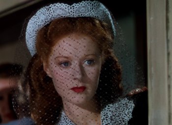 Movie still from “The Red Shoes” (1948), directed by Michael Powell – A person wearing a hat and a veil; Close Up shot, High angle