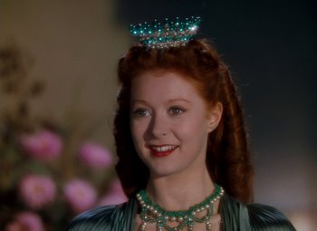 Movie still from “The Red Shoes” (1948), directed by Michael Powell – A woman with red hair wearing a tiara; Close Up shot, Low angle